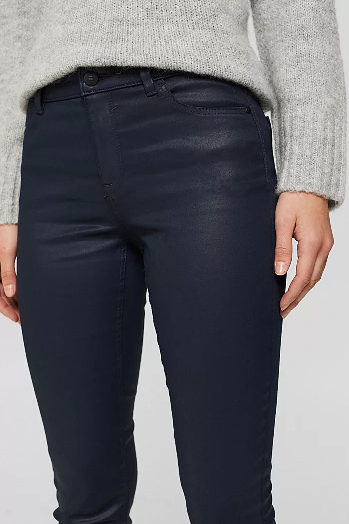 Coated stretch trousers with slits
